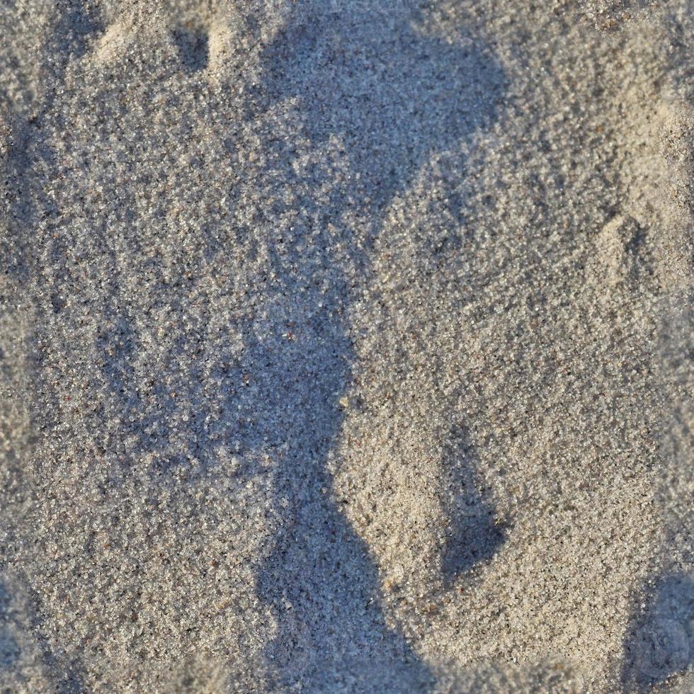 modèle de texture transparente photo réaliste de sable sur une plage