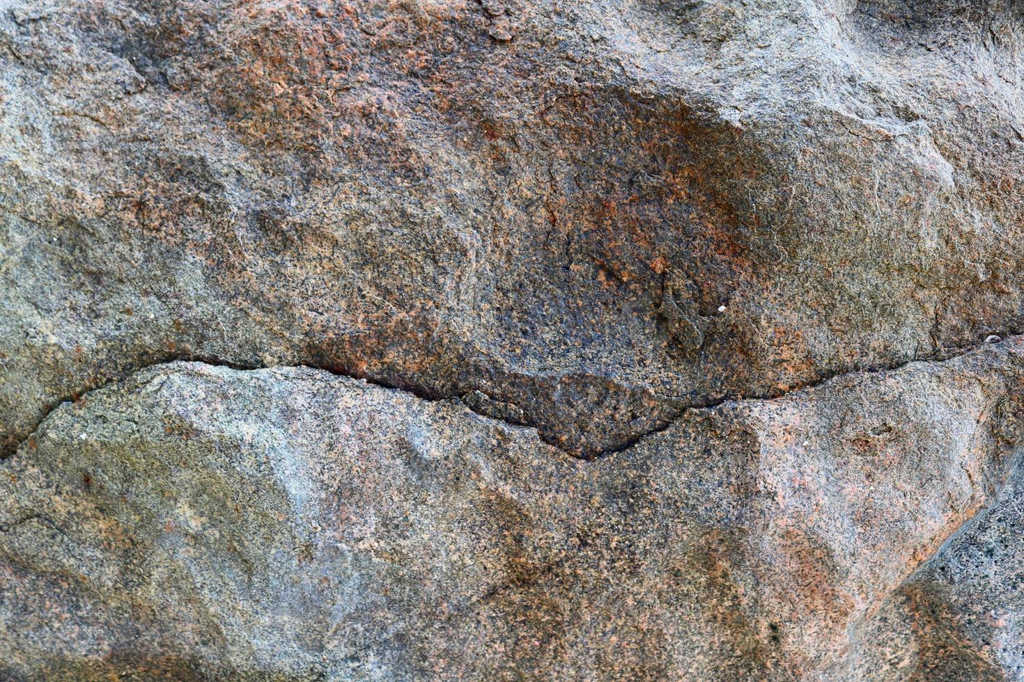 vue rapprochée sur une texture de mur de granit et de pierre en haute résolution. photo