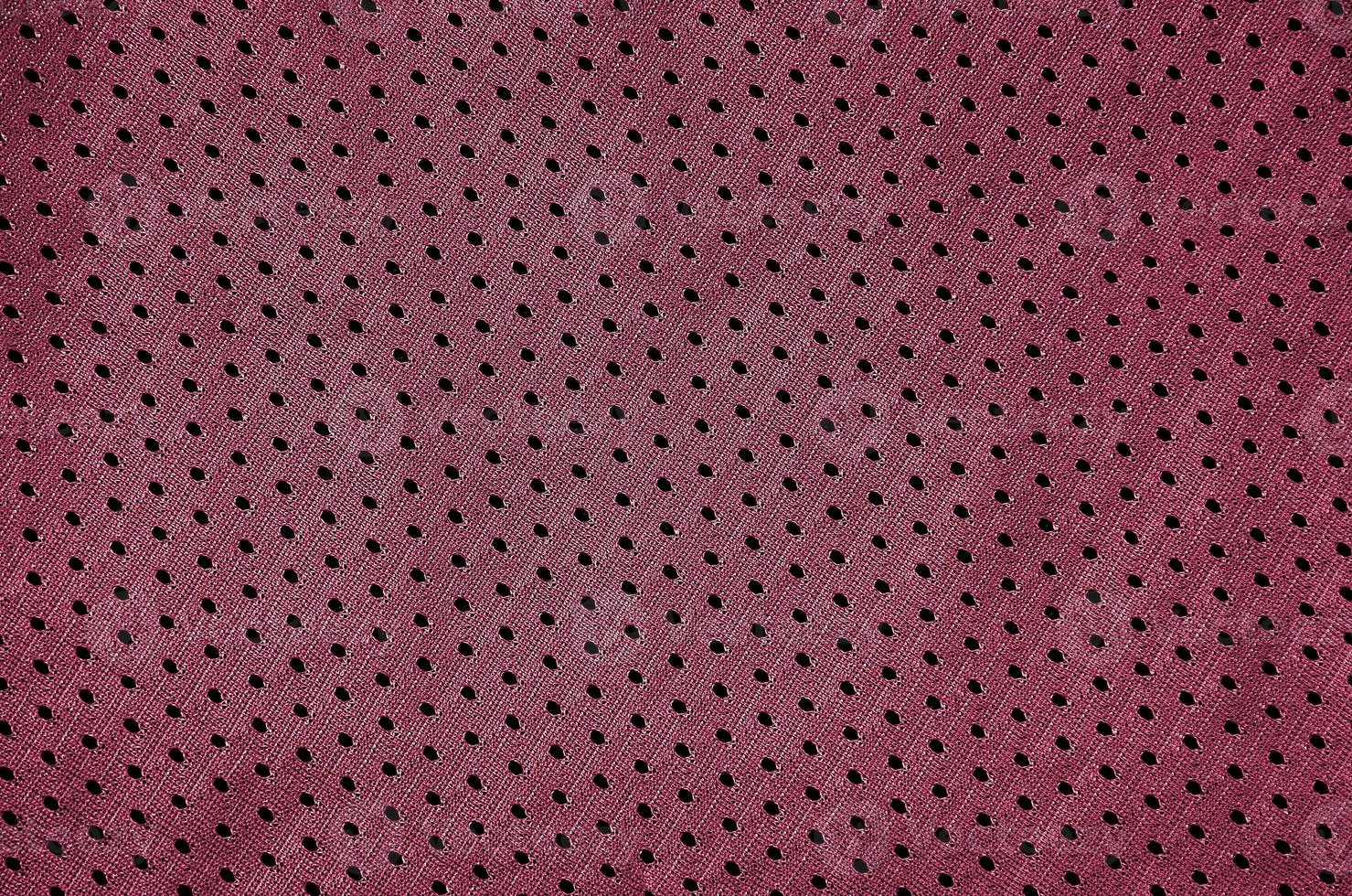 fond de texture de tissu de vêtements de sport. vue de dessus de la surface textile en tissu. image tonique en viva magenta, couleur de l'année 2023 photo