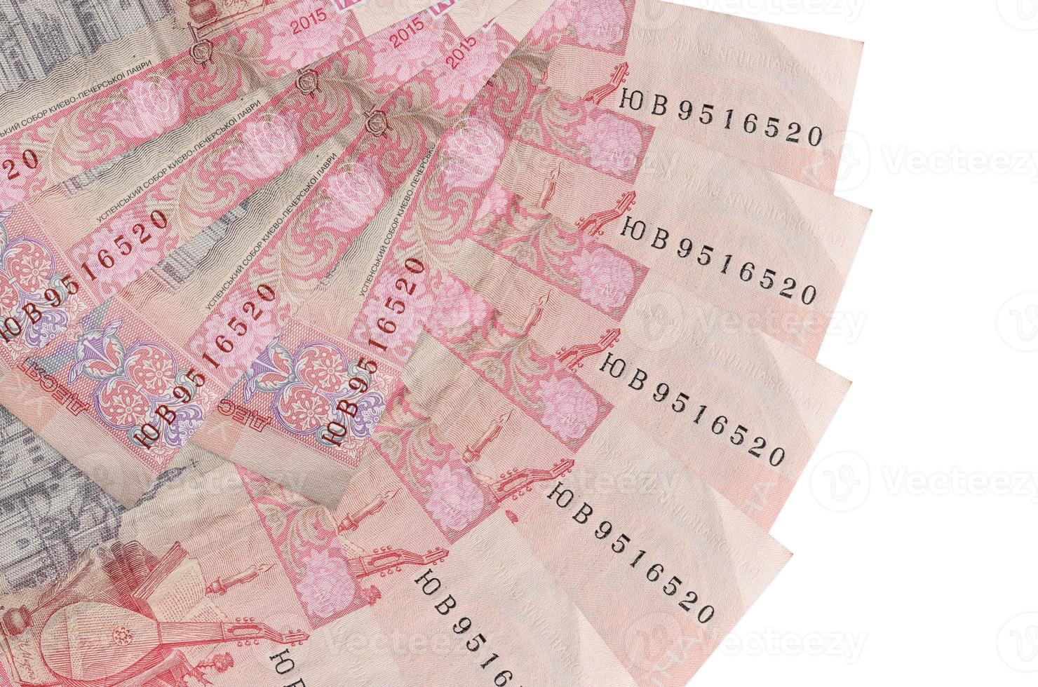 10 factures de hryvnias ukrainiennes se trouvent isolées sur fond blanc avec espace de copie empilés en forme d'éventail de près photo