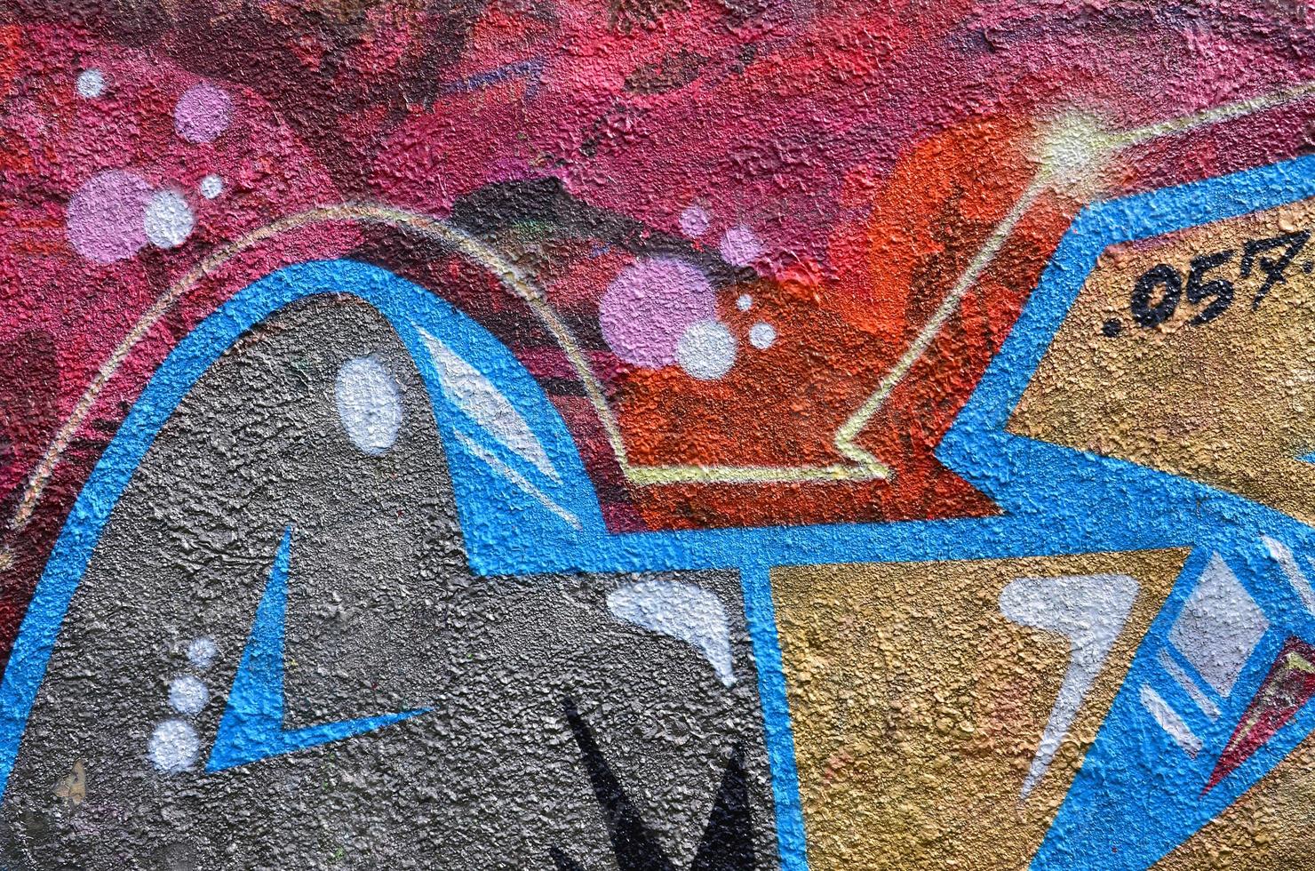 beaux graffitis d'art de rue. couleur abstraite dessin créatif couleurs de mode sur les murs de la ville. culture urbaine contemporaine. peinture de titre sur les murs. protestation des jeunes de la culture photo