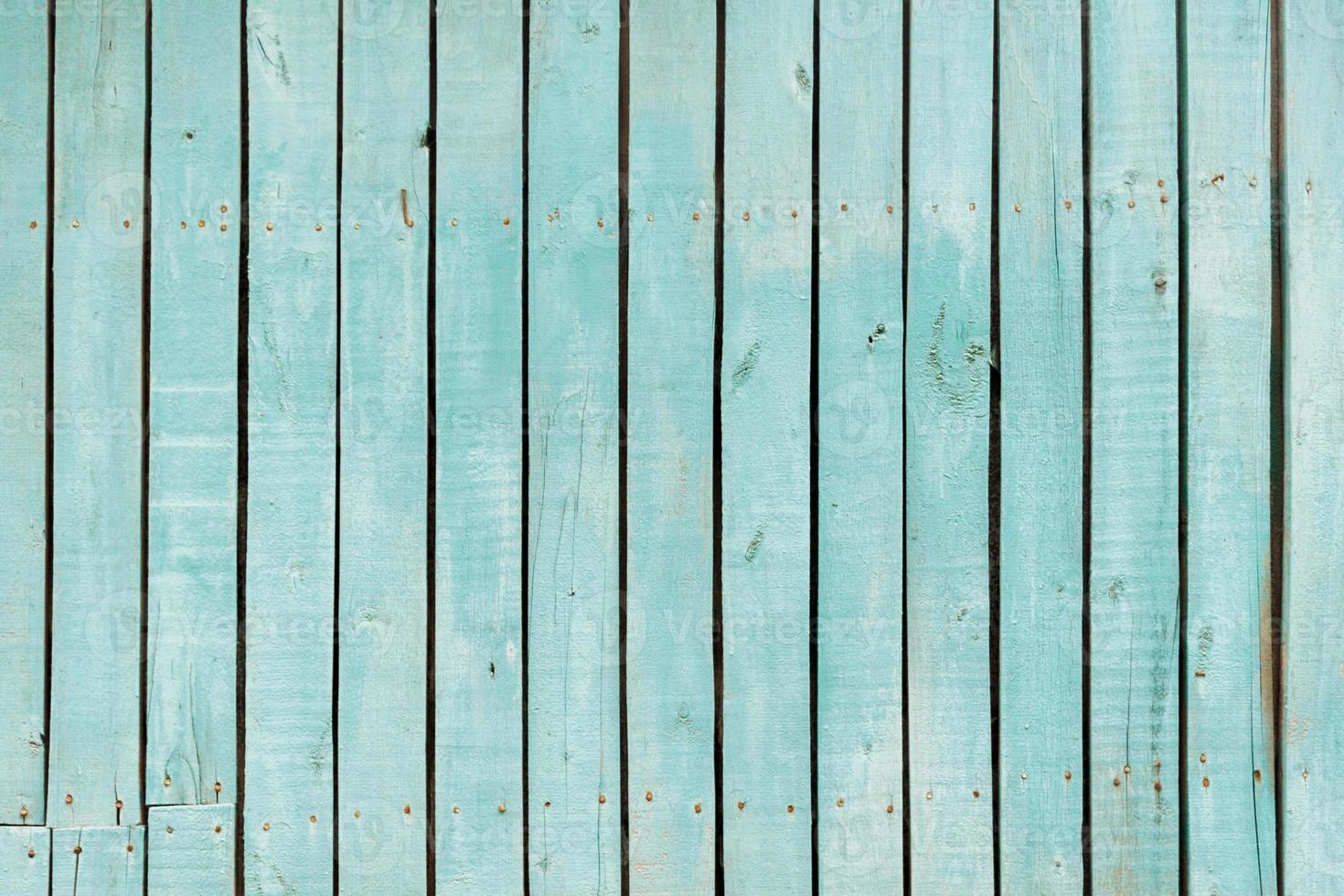 vieille clôture en bois bleue. texture de palissade en bois. fond de planches photo