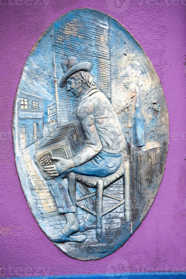 Joueur de bandonéon peint mur de la maison à buenos aires photo