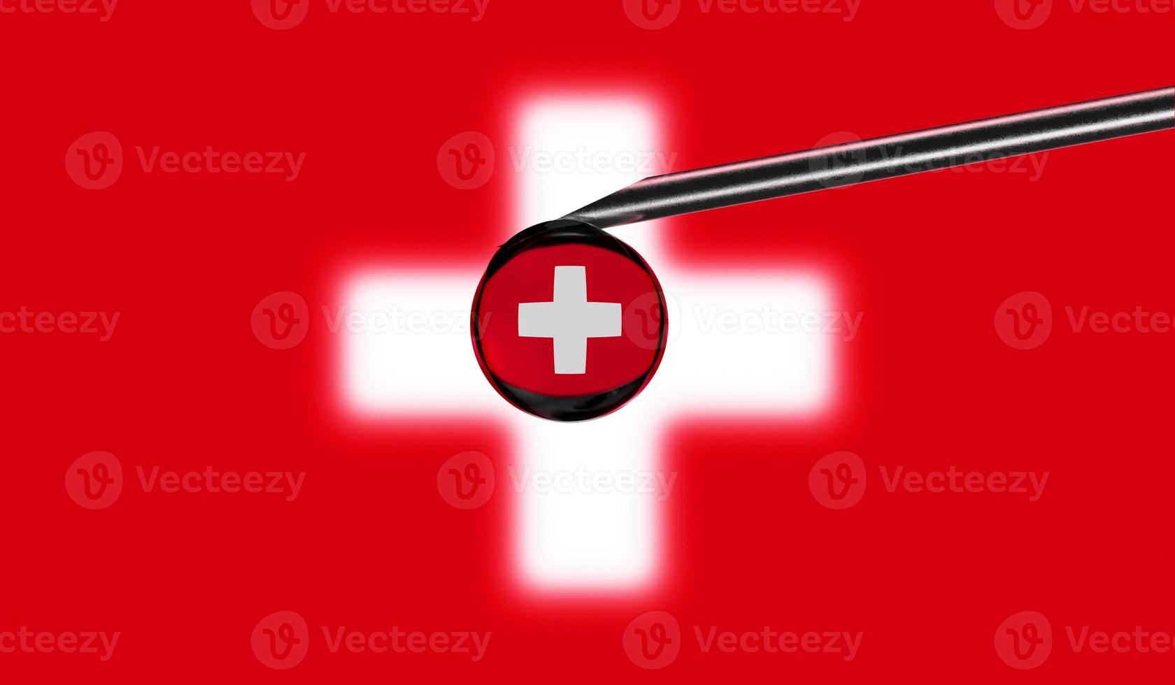 seringue de vaccin avec goutte sur l'aiguille sur fond de drapeau national de la suisse. vaccination de concept médical. protection contre la pandémie de coronavirus sras-cov-2. idée de sécurité nationale. photo