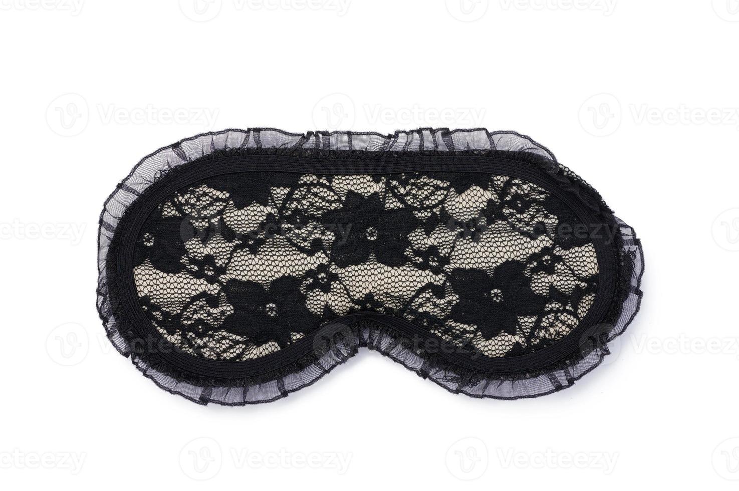 Masque de sommeil en dentelle textile noir sur fond blanc isolé photo