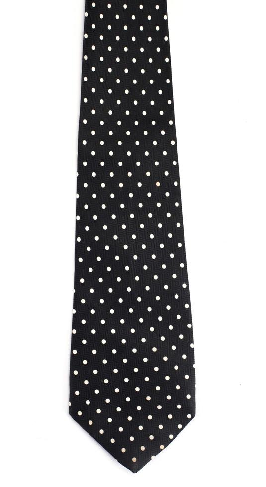 Cravate à pois noir isolé sur fond blanc photo