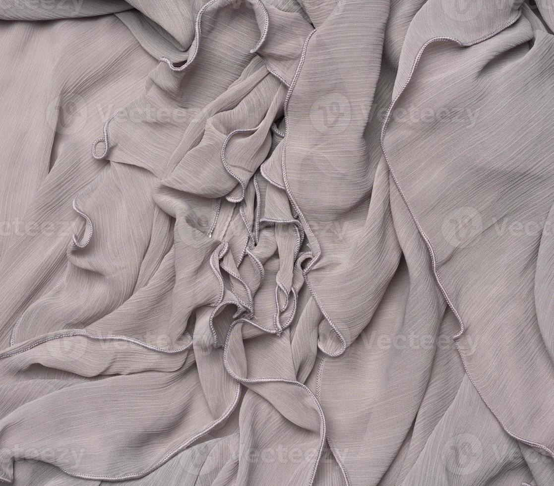 tissu de soie gris plié, plein cadre photo