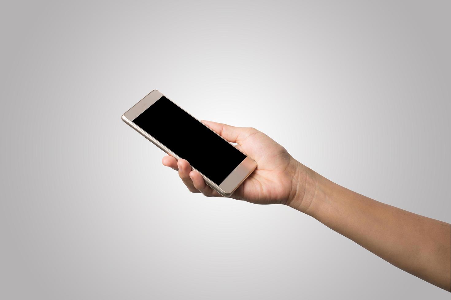 main de femme tenant écran blanc de téléphone intelligent photo