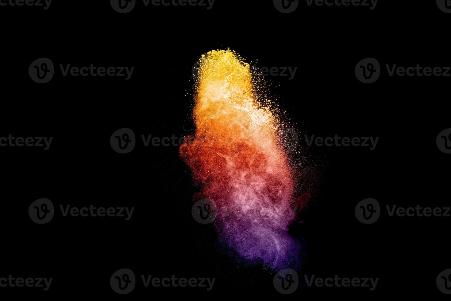 coloré poussière particules texturé fond.multicolore poudre explosion sur noir Contexte. photo