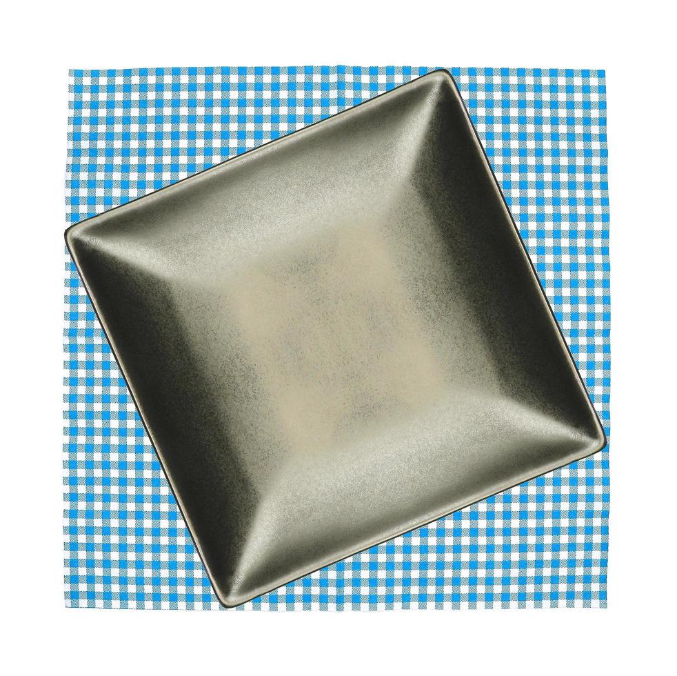 assiette carrée sur tissu bleu photo