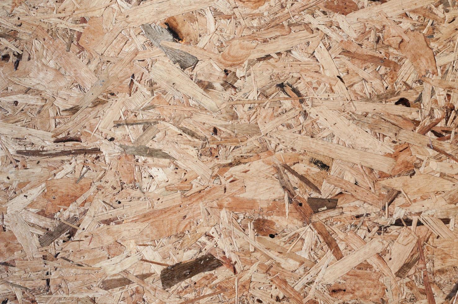 panneau de texture bois fabriqué à partir d'un morceau de bois patchwork de bois brut formant un beau motif de bois de parquet, motif de mur en bois photo