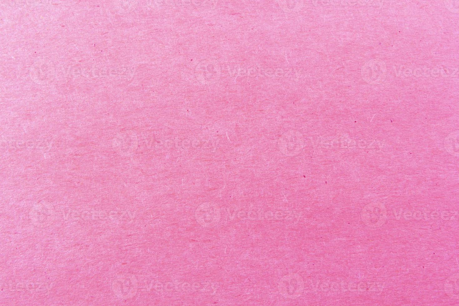 Gros plan du motif de texture de papier rose clair pour le fond photo