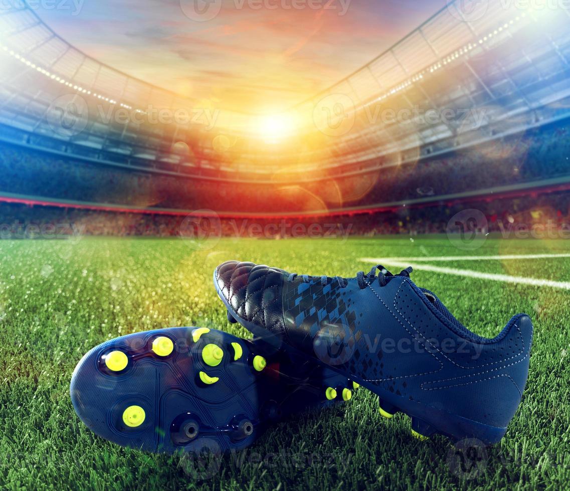 football des chaussures sur terrain de jeux de une gros stade photo