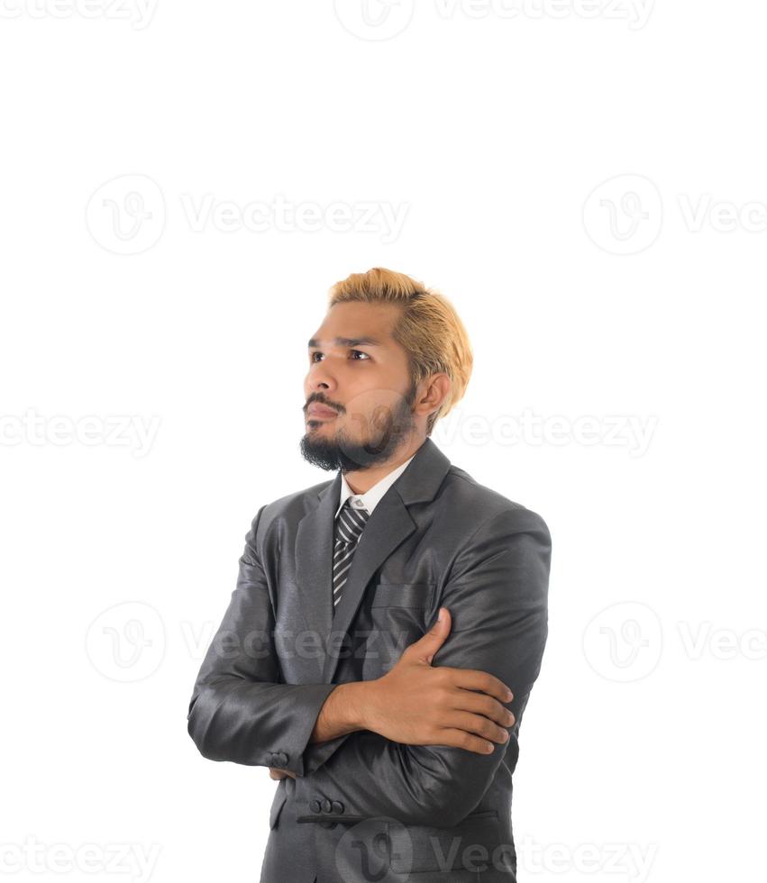 Confiant jeune homme d'affaires en costume isolé sur fond blanc photo