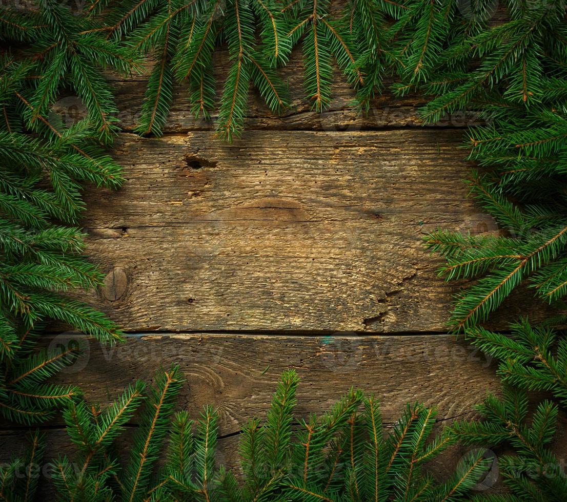 Noël arbre branches sur en bois texture prêt pour votre conception photo