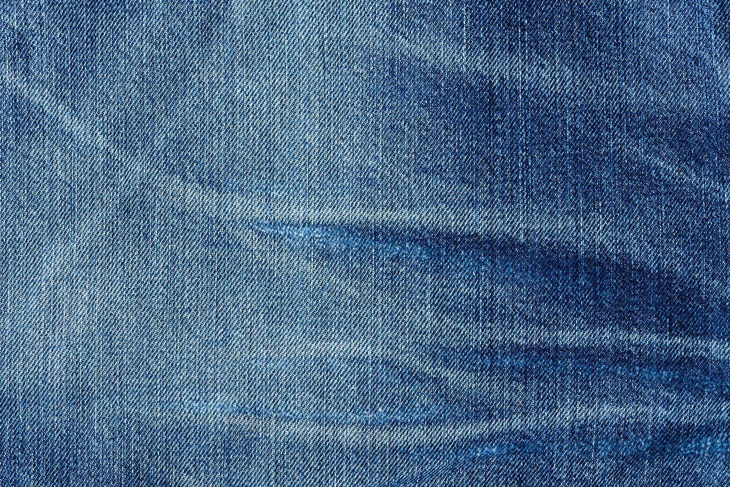 vieux bleu jeans en tissu Contexte texture. proche en haut photo
