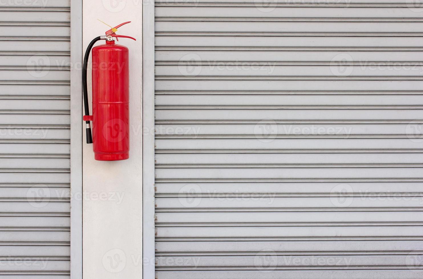 Feu extincteur sur le obturateur porte à Accueil photo