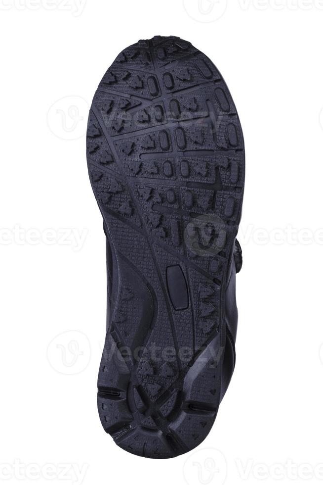 noir cannelé chaussure Unique sur une blanc Contexte. photo