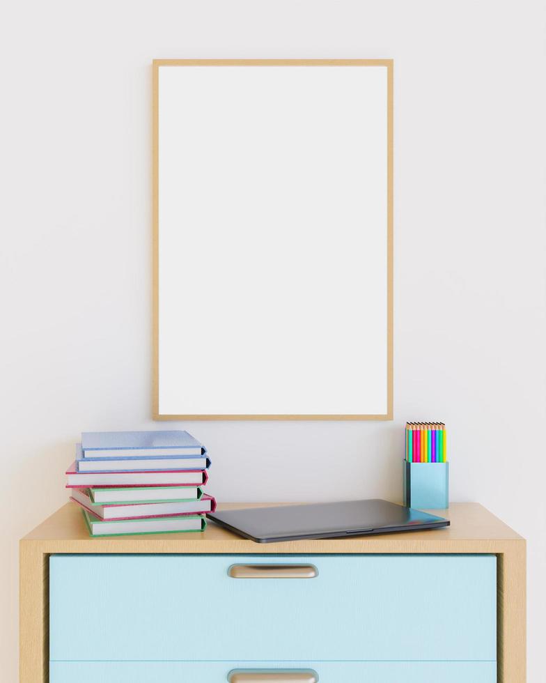 cadre en bois sur des meubles avec ordinateur portable, livres et crayons sur le dessus photo