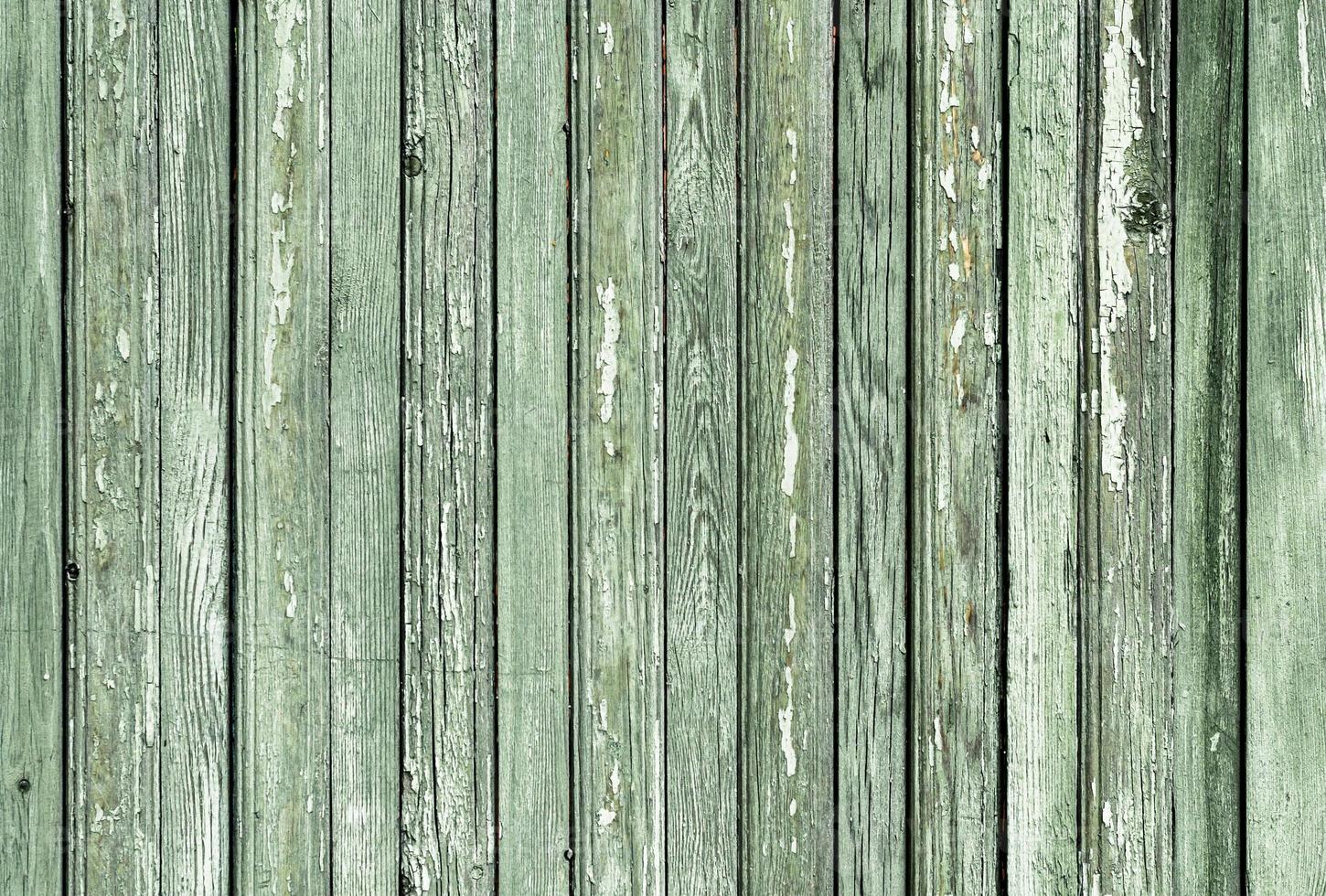 Motif de fond de texture de la vieille surface en bois peint avec de la peinture verte photo