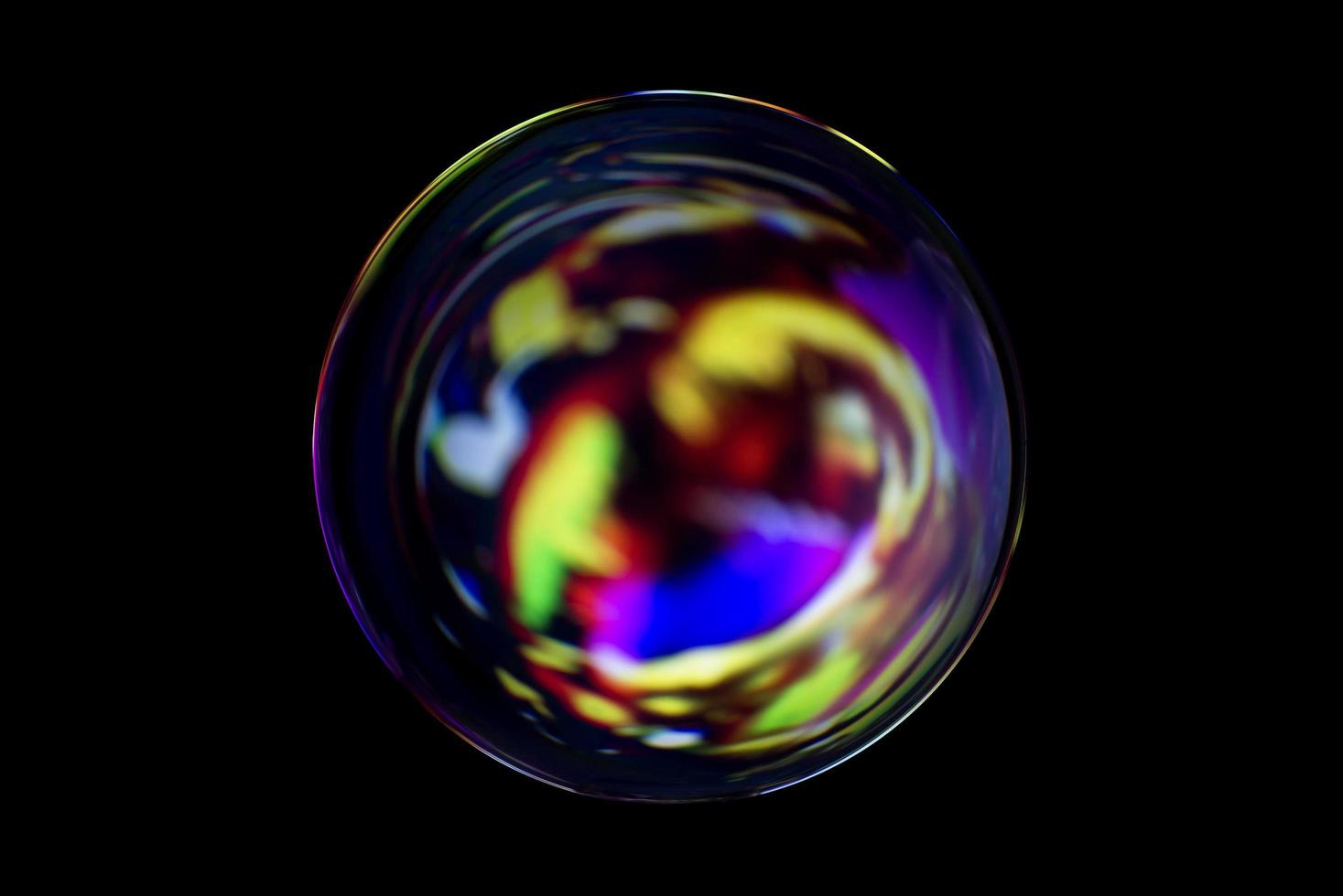 une sphère abstraite avec un motif flou isolé sur fond noir. photo