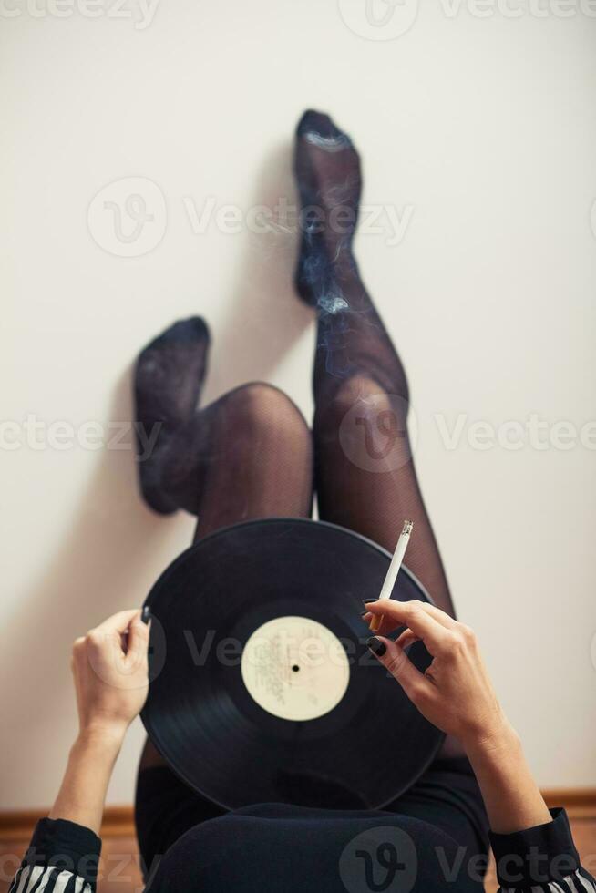 jambes avec vinyle record photo