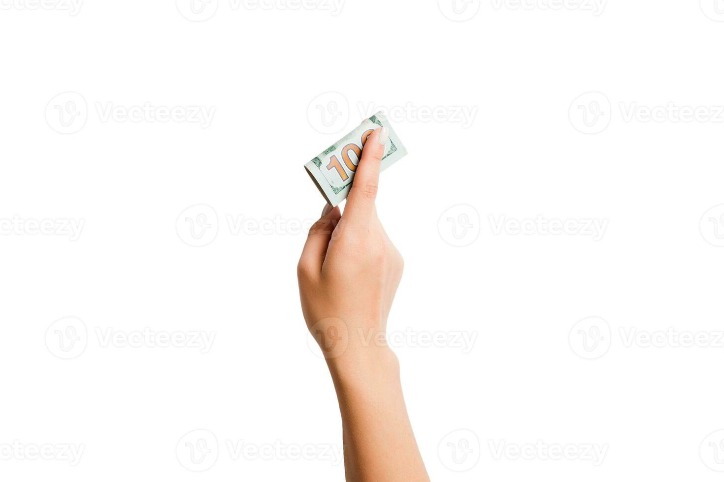 isolé image de femelle main en portant une paquet de dollars sur blanc Contexte. Haut vue de Paiement concept photo