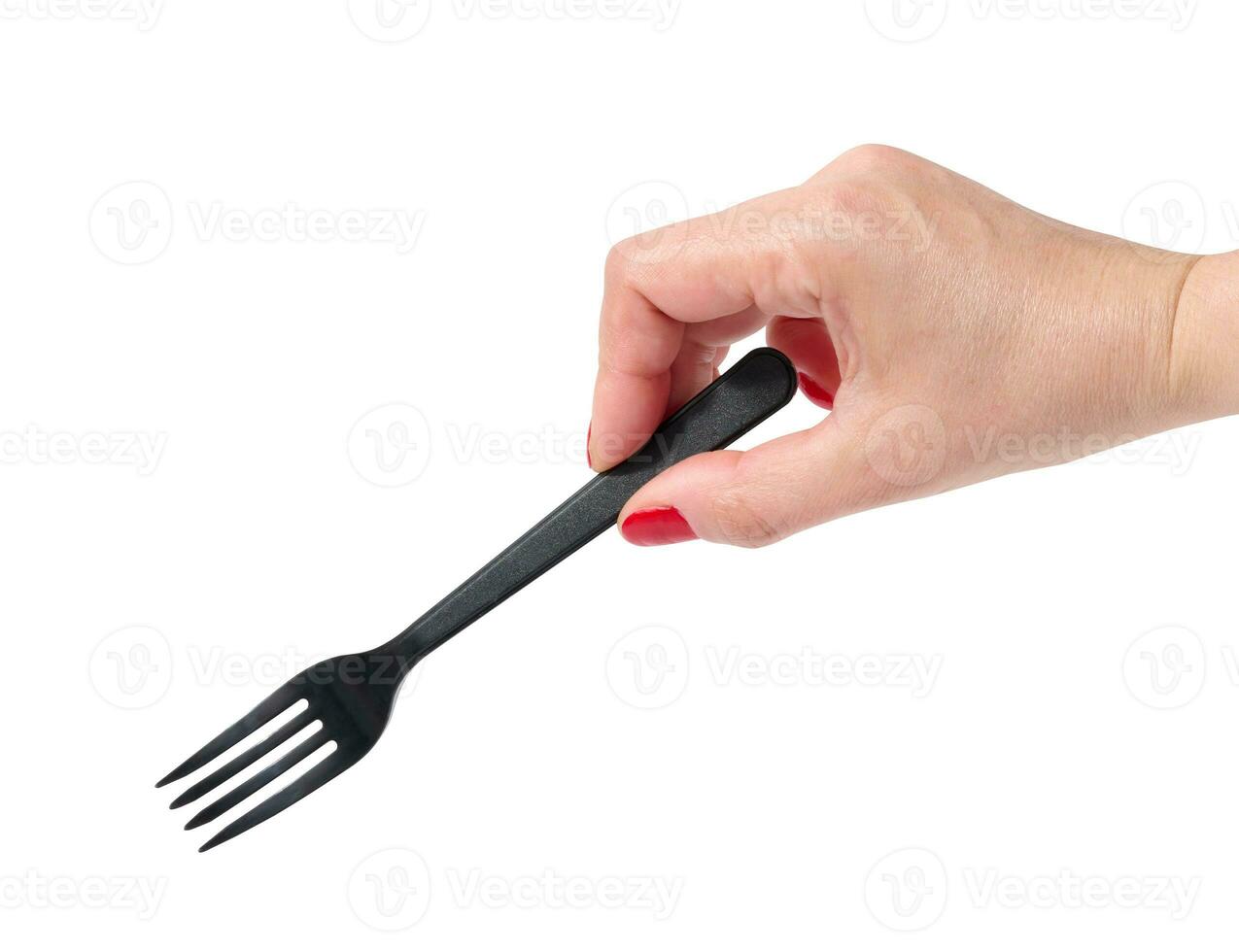 femme main en portant une noir Plastique fourchette sur une blanc Contexte photo