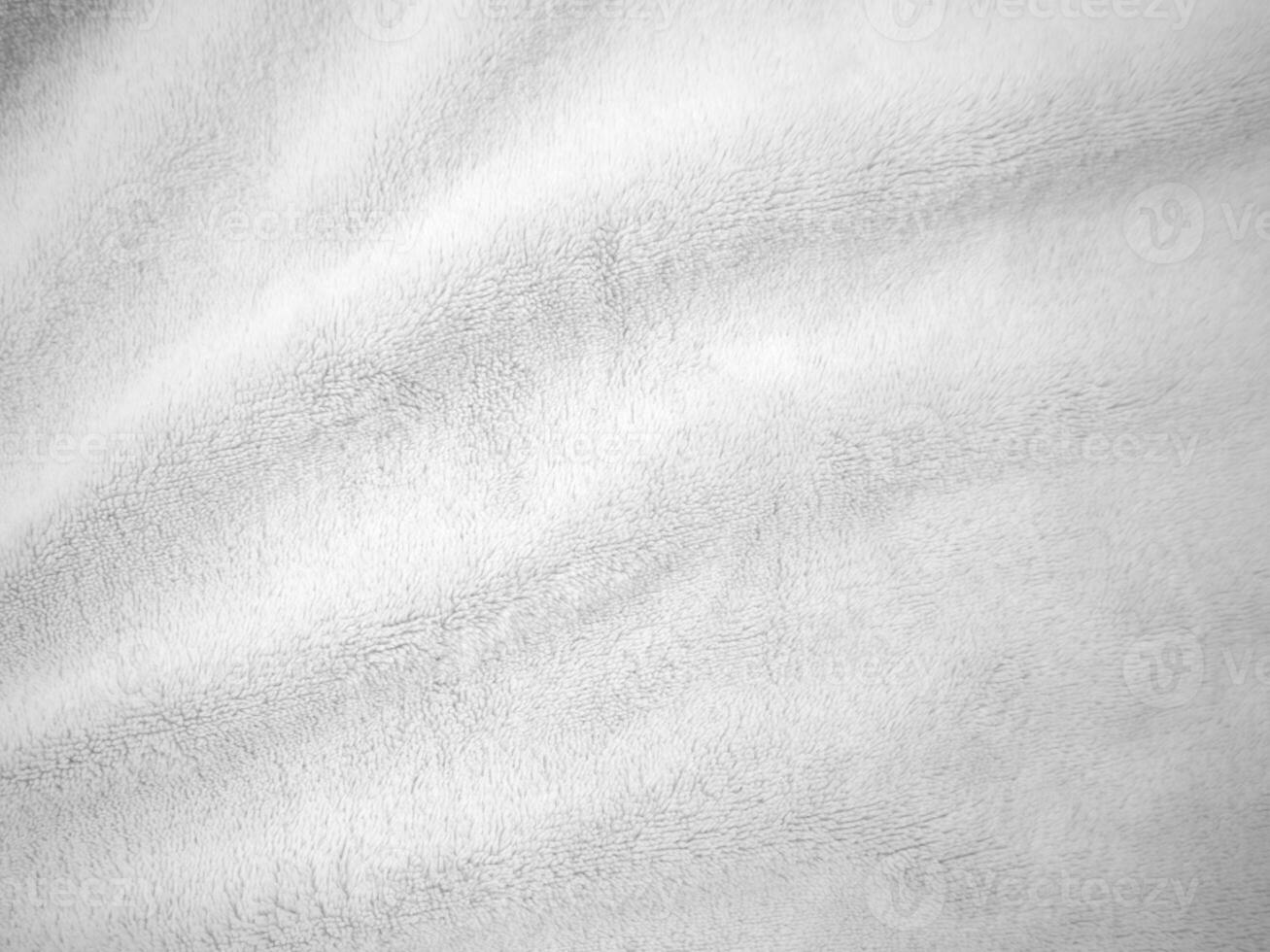 fond de texture de laine propre blanche. laine de mouton naturelle légère. coton blanc sans couture. texture de fourrure moelleuse pour les concepteurs. gros plan fragment de tapis de laine blanche. photo