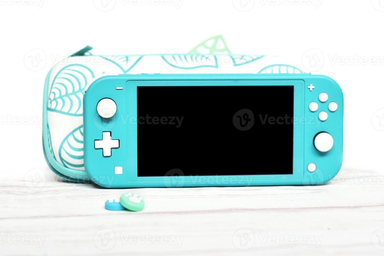 nintendo switch lite turquoise avec étui photo