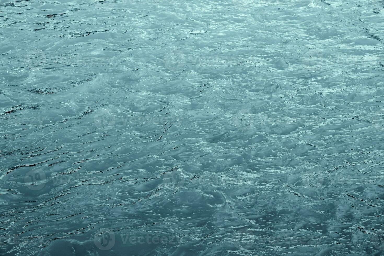 le texture de le l'eau de le rivière. Naturel l'eau Contexte avec ondulations et vagues. photo