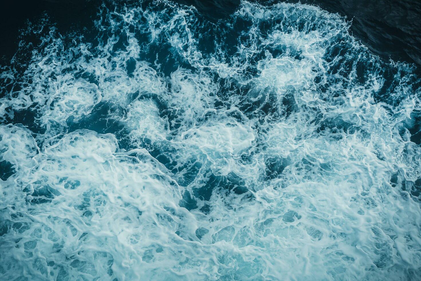 vue de au dessus turquoise océan vagues Contexte. photo