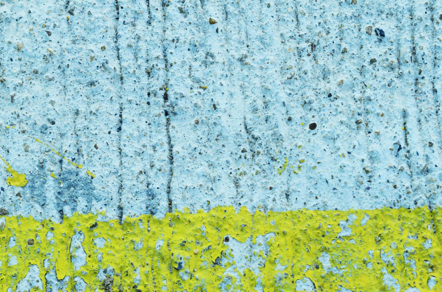 Grunge arrière-plans abstraits avec de la peinture écaillée de couleur jaune sur la texture du mur de béton photo