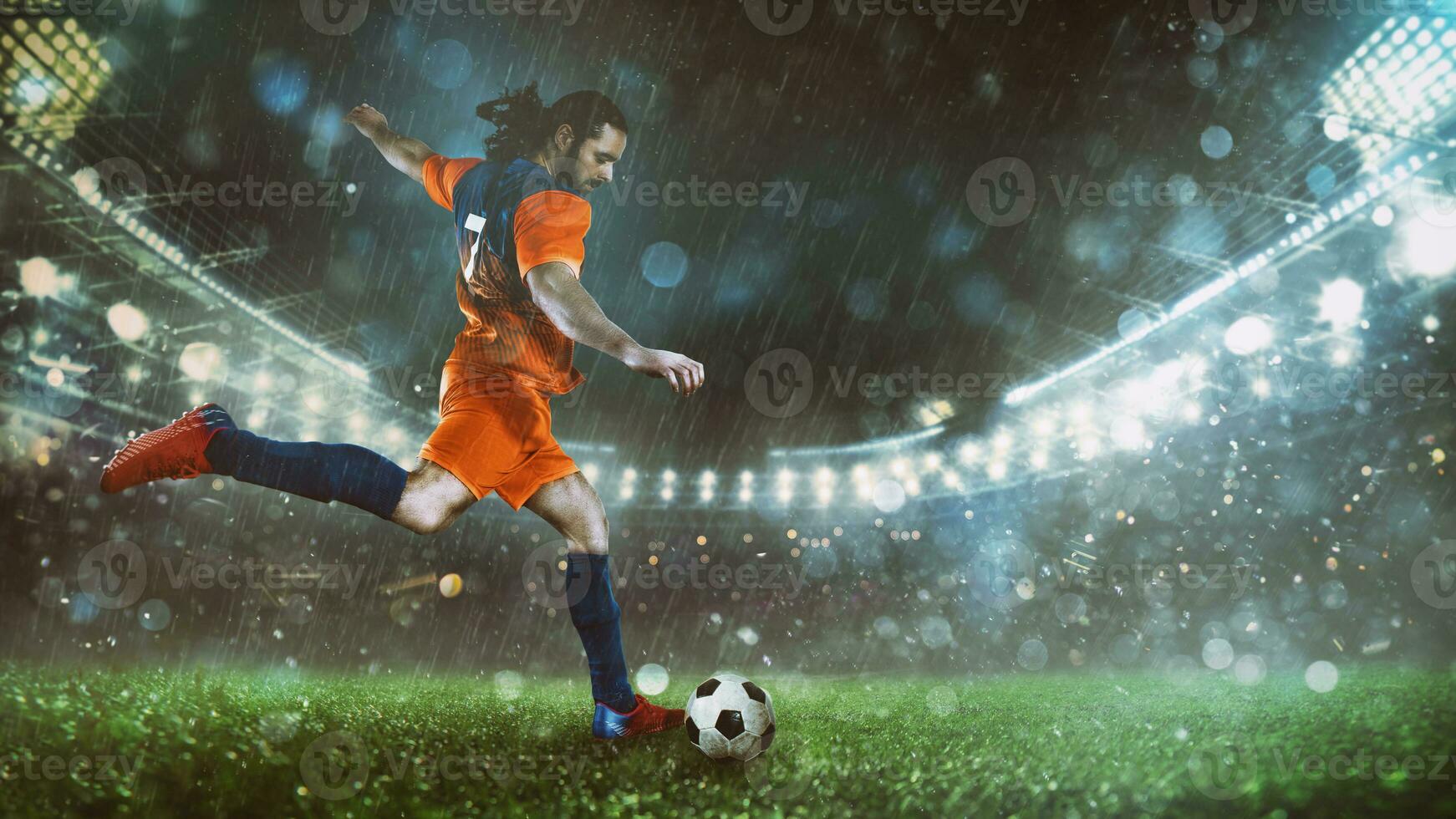 football scène à nuit rencontre avec joueur dans une Orange uniforme coups de pied le Balle avec Puissance photo