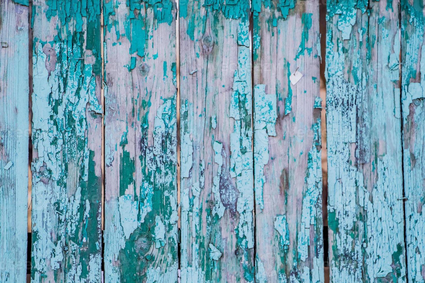 texture de la vieille peinture craquelée sur des planches de bois. photo