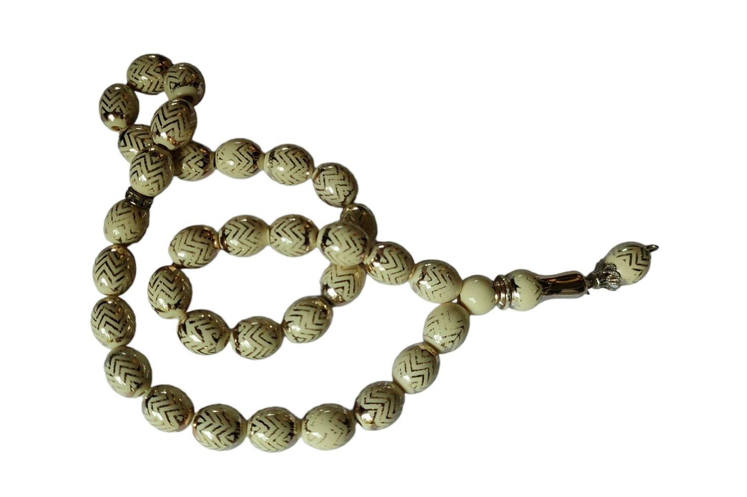 tasbih oud solide bois pour prier à Allah à musulman religion photo