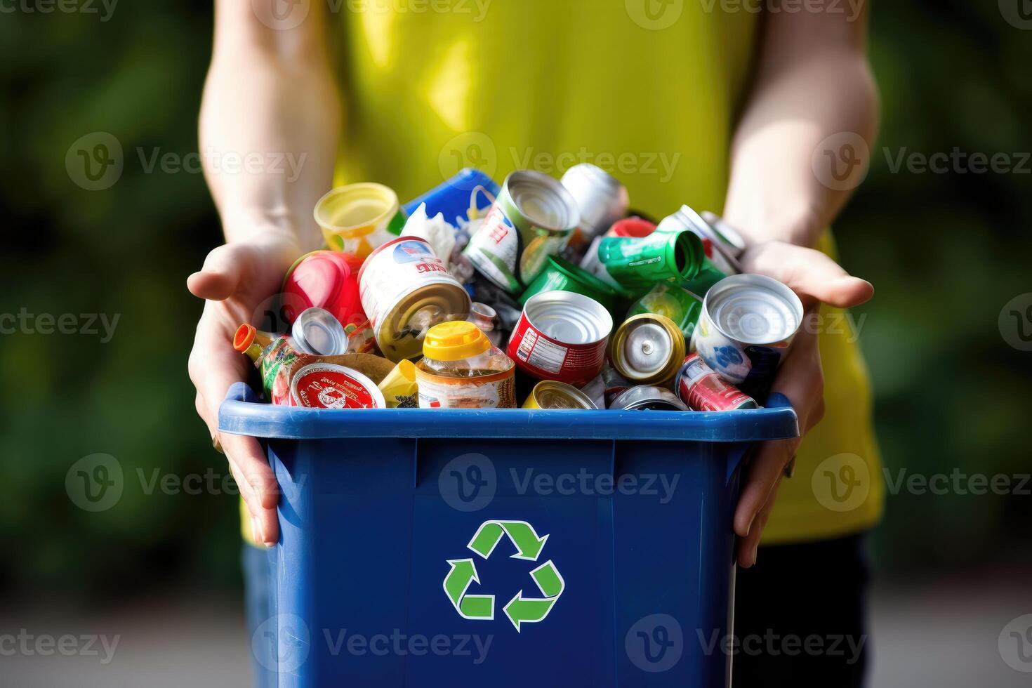 une coup de mains en portant une recyclage poubelle rempli avec divers recyclable articles. génératif ai photo