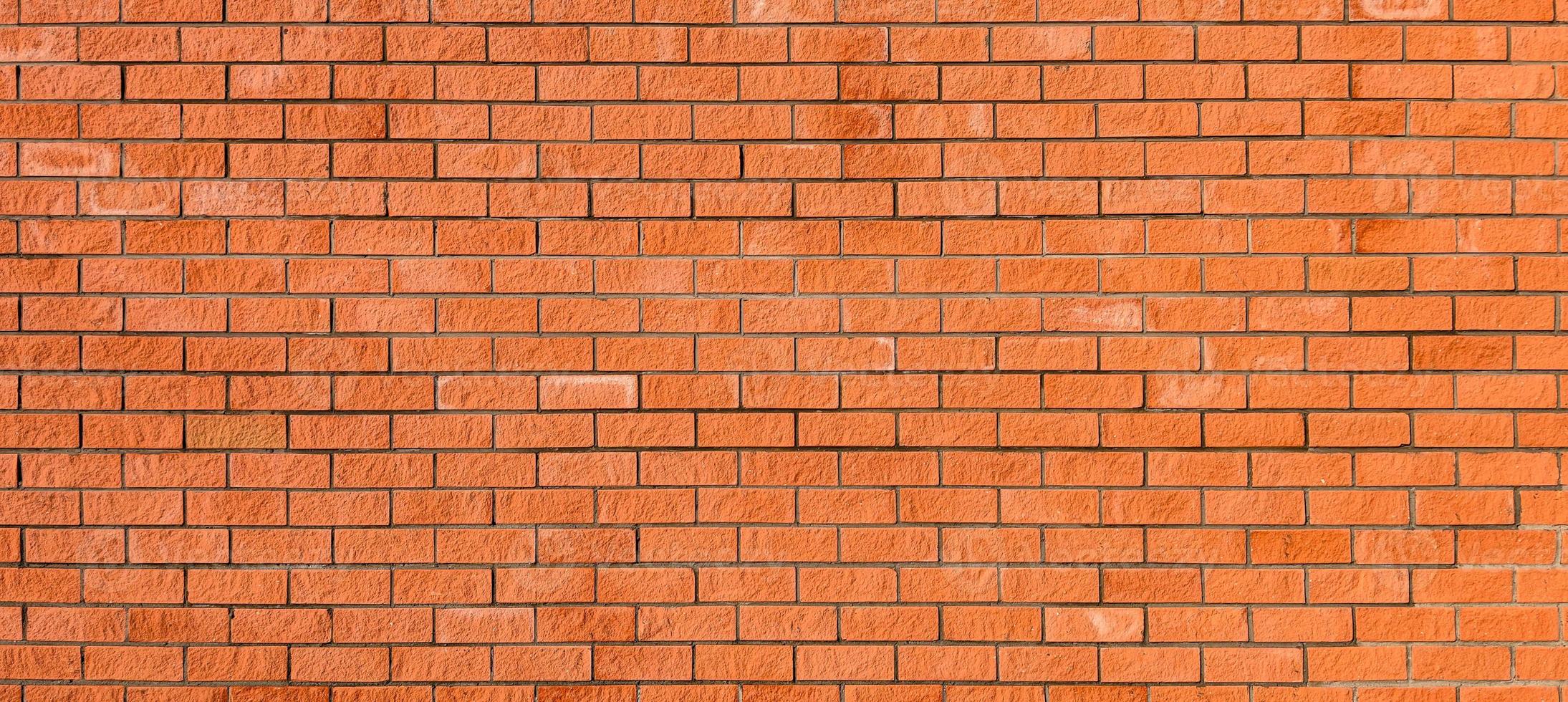 nouveau mur de briques rouges, large panorama de maçonnerie. fond idéal pour tous les projets. photo