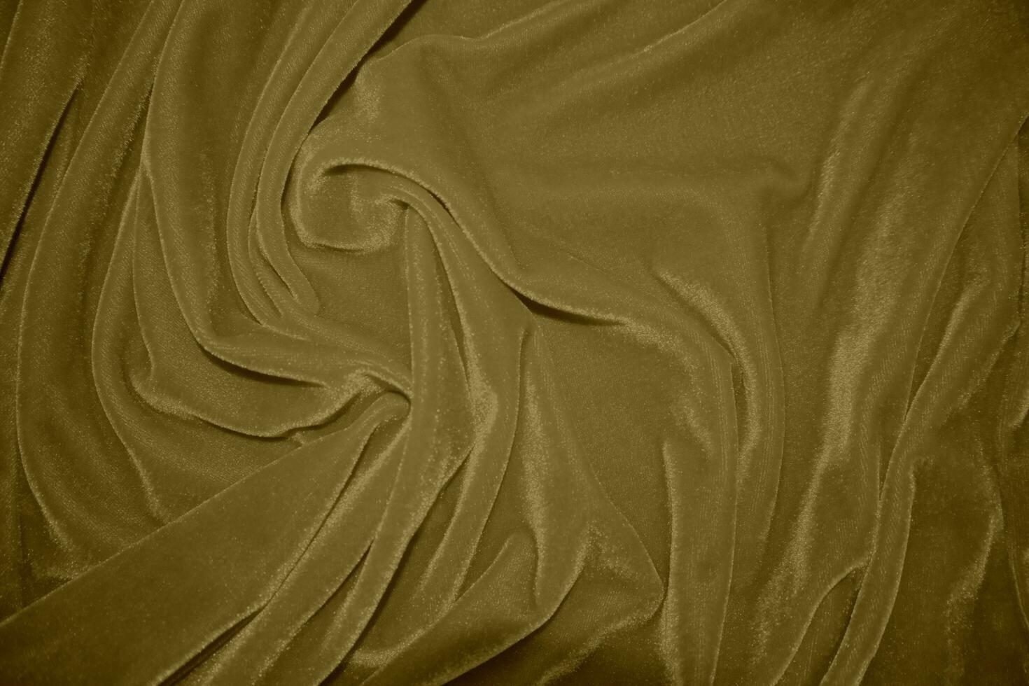 d'or velours en tissu texture utilisé comme Contexte. blond Couleur panne en tissu Contexte de doux et lisse textile matériel. écrasé velours .luxe Jaune Ton pour soie. photo