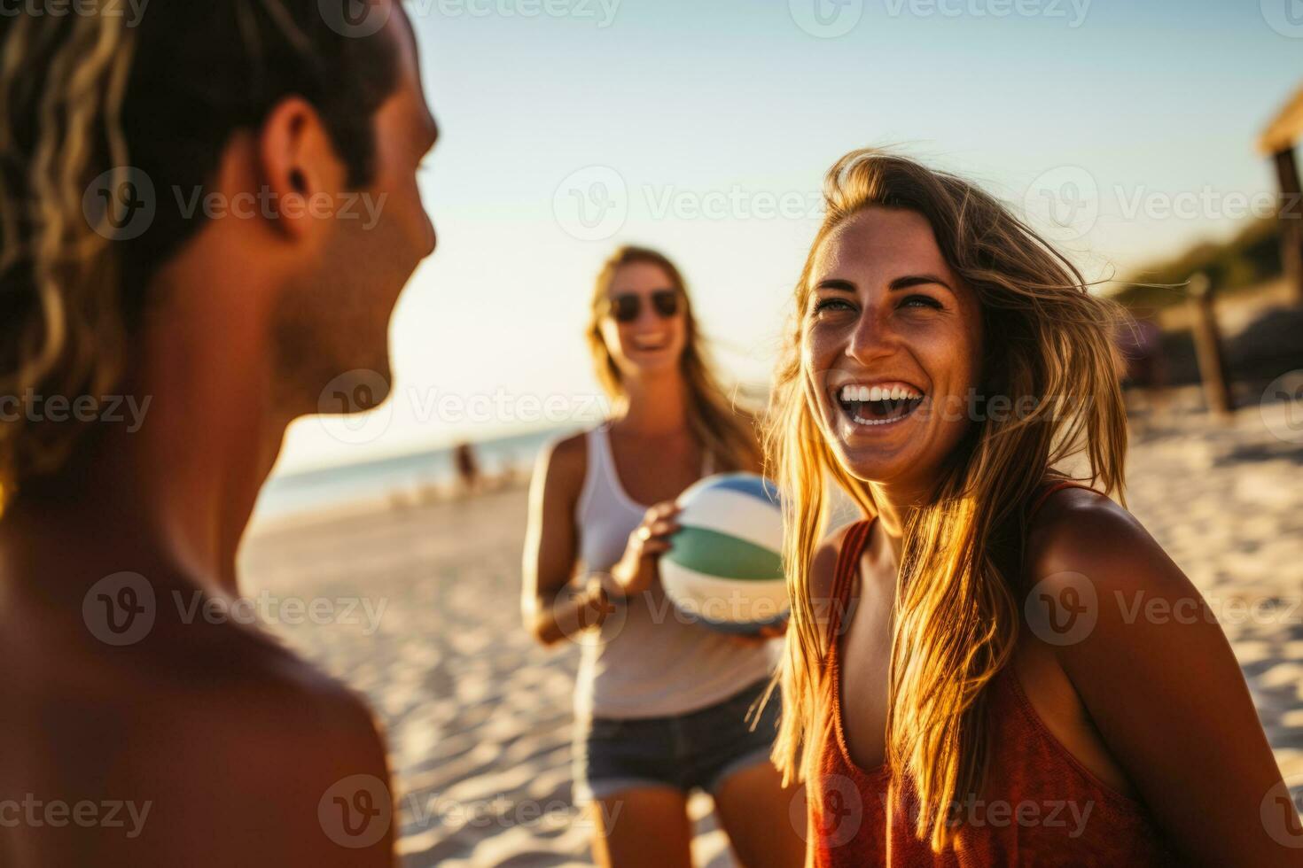 amis jouant au beach-volley photo