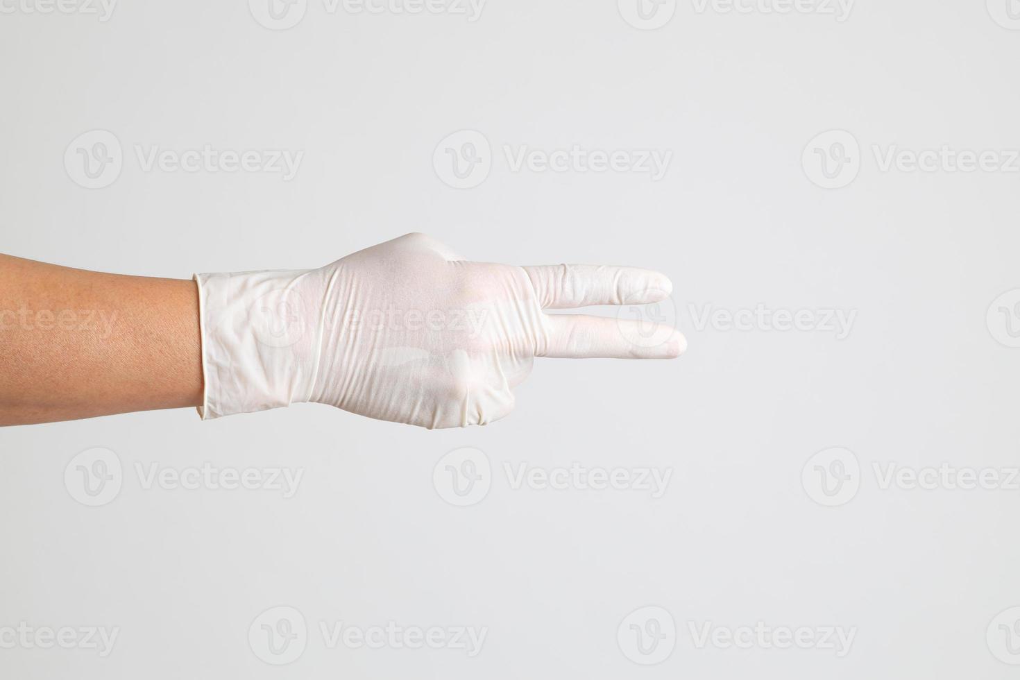 main avec des gants médicaux photo