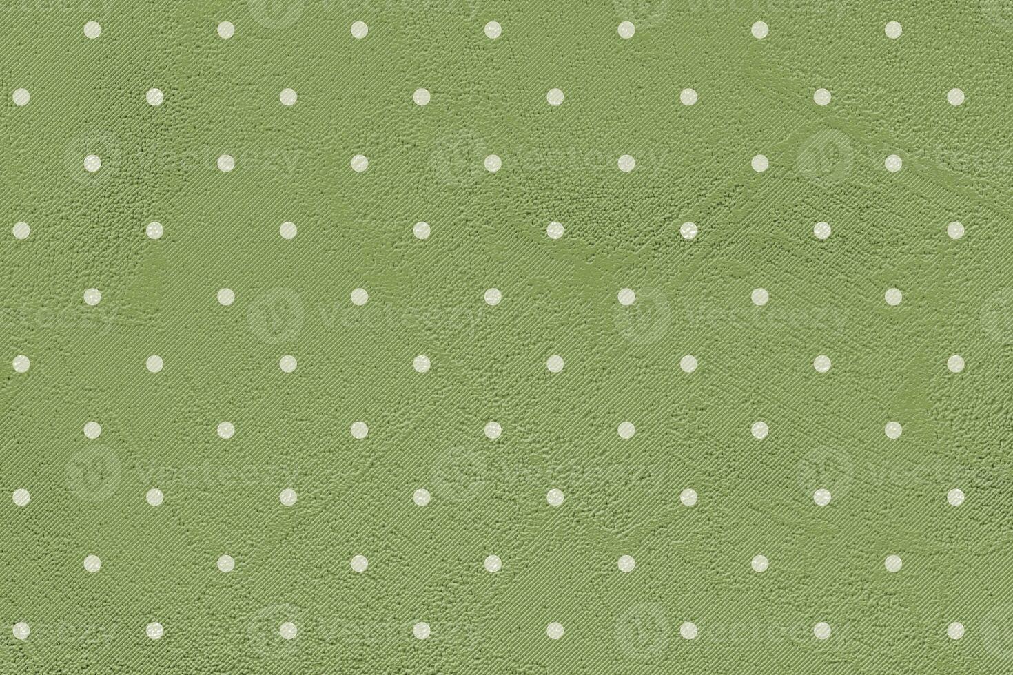 vert papier Contexte avec blanc polka points. photo