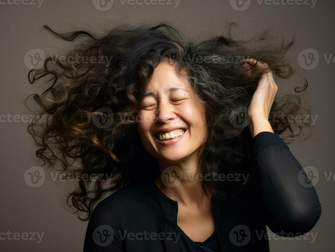 50 année vieux asiatique femme dans émotif dynamique pose sur solide Contexte ai génératif photo