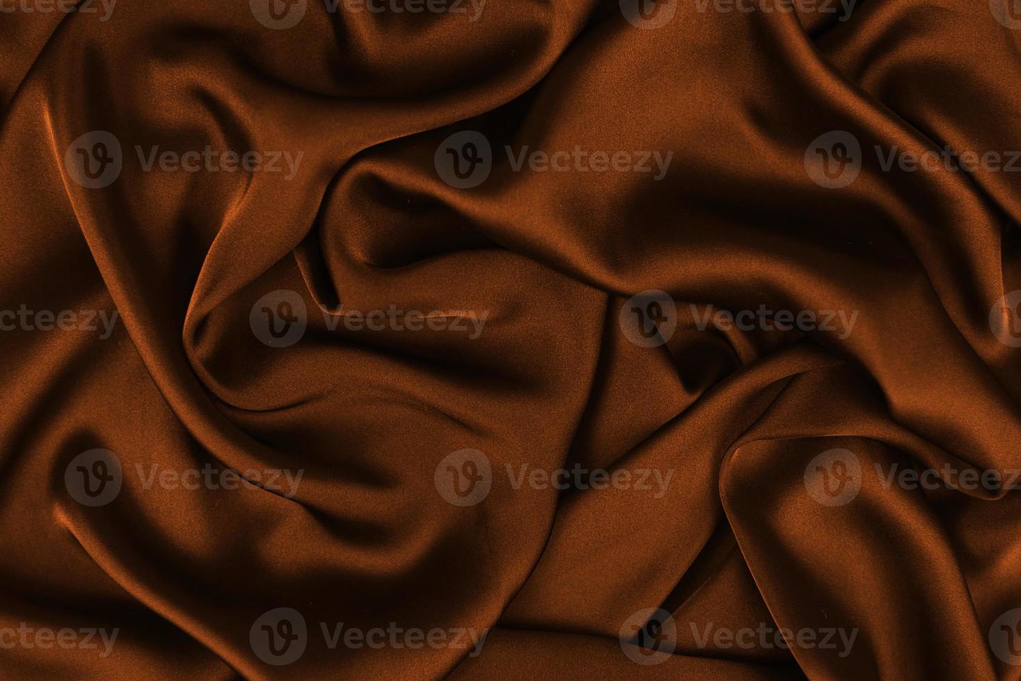 La texture lisse et élégante de la soie ou du satin peut être utilisée comme arrière-plan abstrait. design de fond luxueux photo