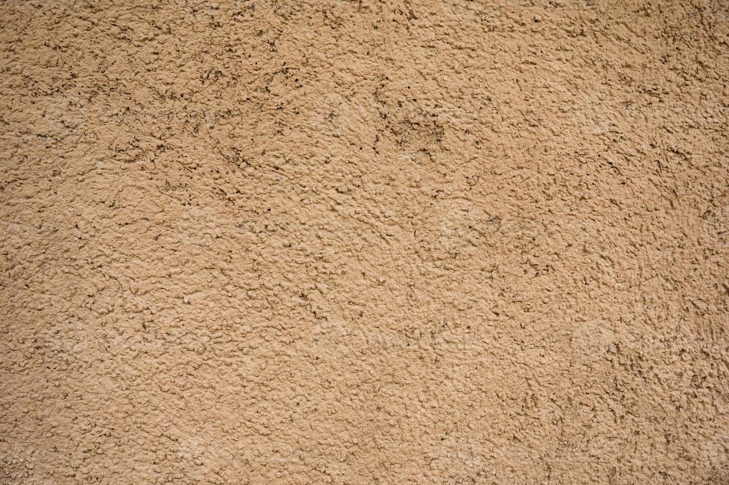 fond de mur de maison de sol argileux brun naturel patiné photo