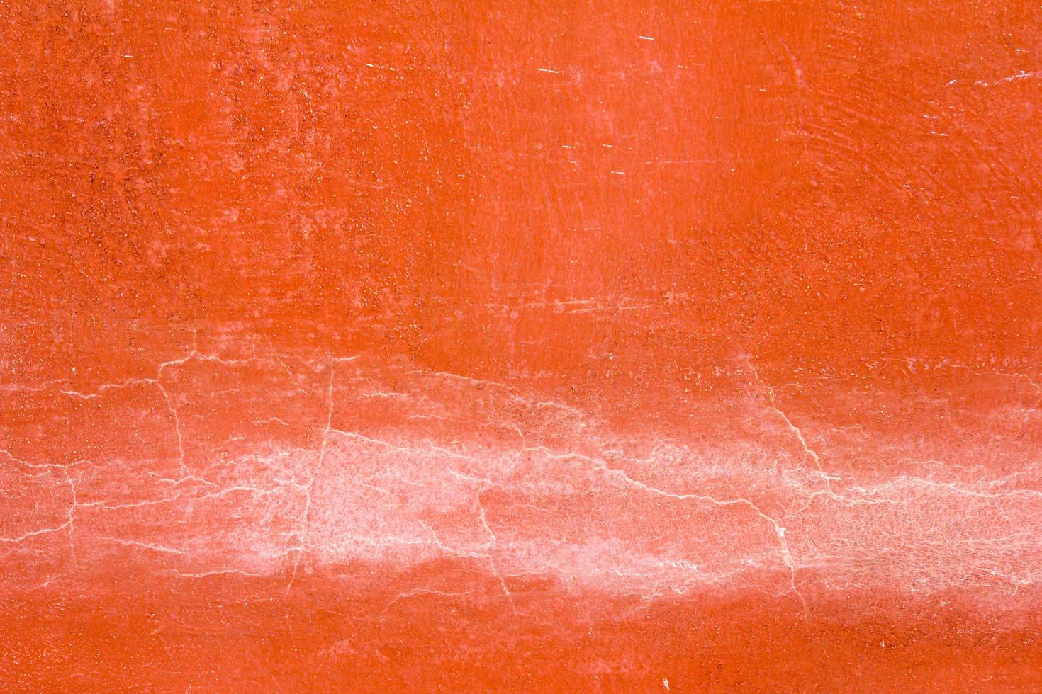 mur de béton de couleur orange avec le fond de fissure photo