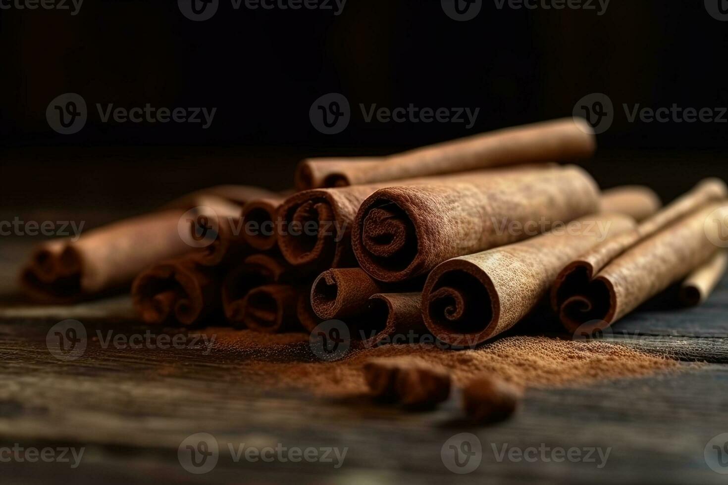 tas de canela cannelle des bâtons proche en haut sur une en bois table dans une foncé clé photo