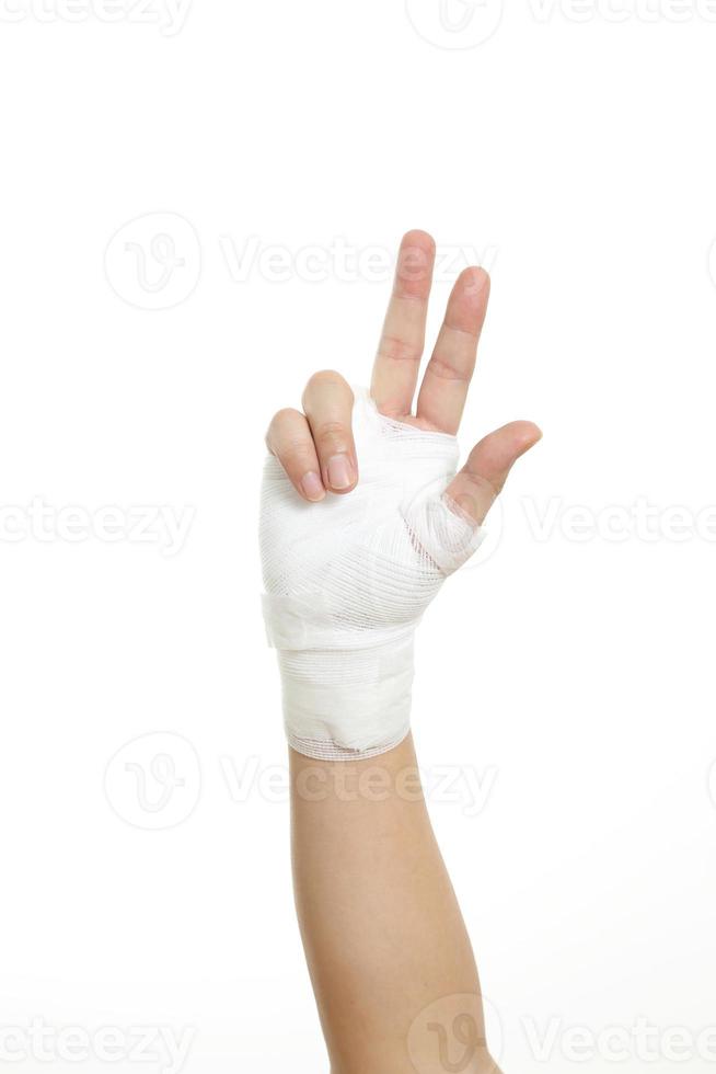 main avec bandage photo
