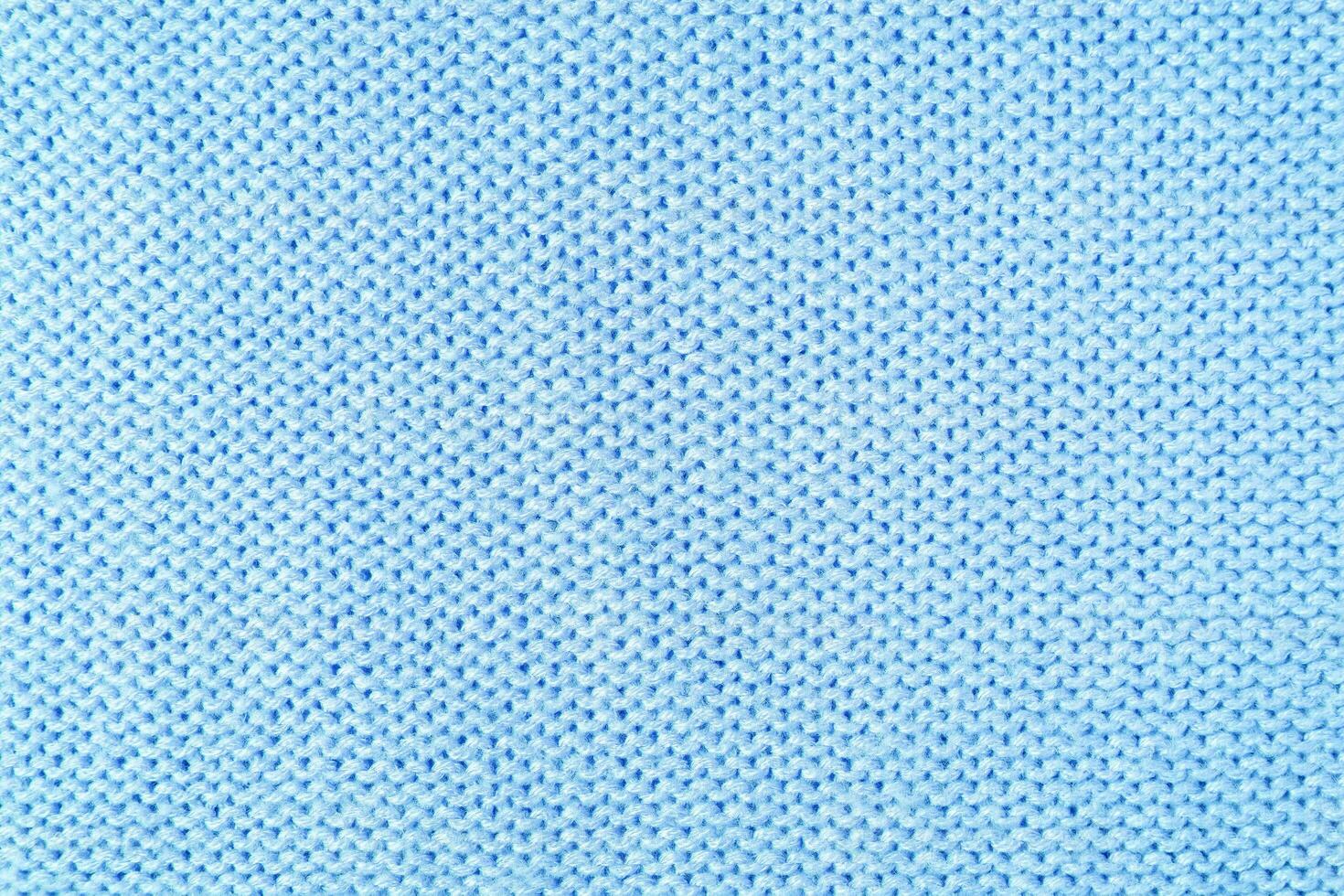 fond de texture de tissu de laine tricot bleu vif. toile de fond textile abstrait photo