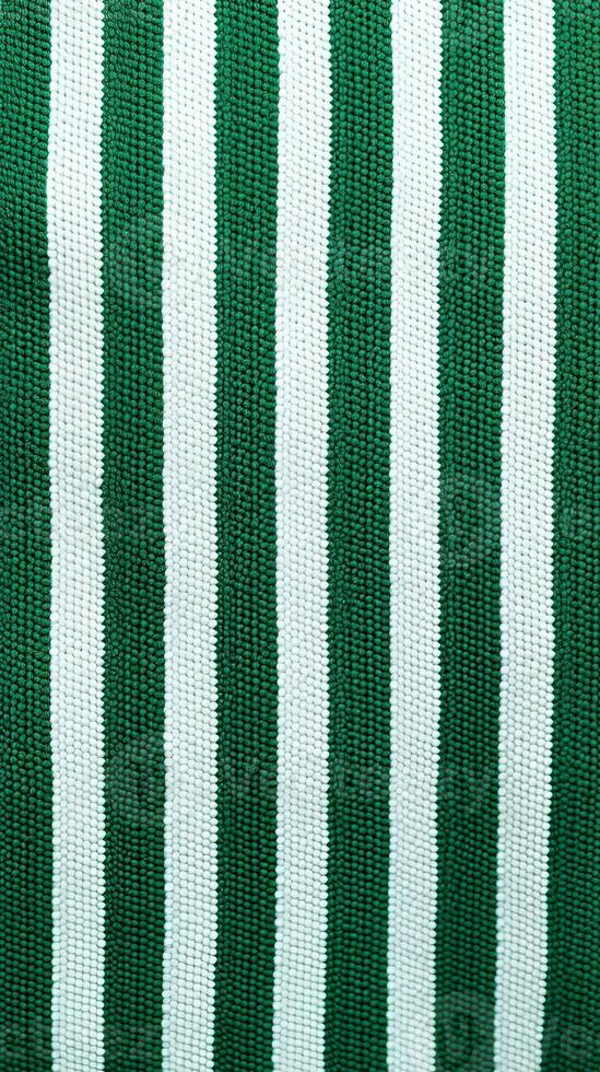 vert et blanc rayé en tissu texture Contexte. ai généré photo